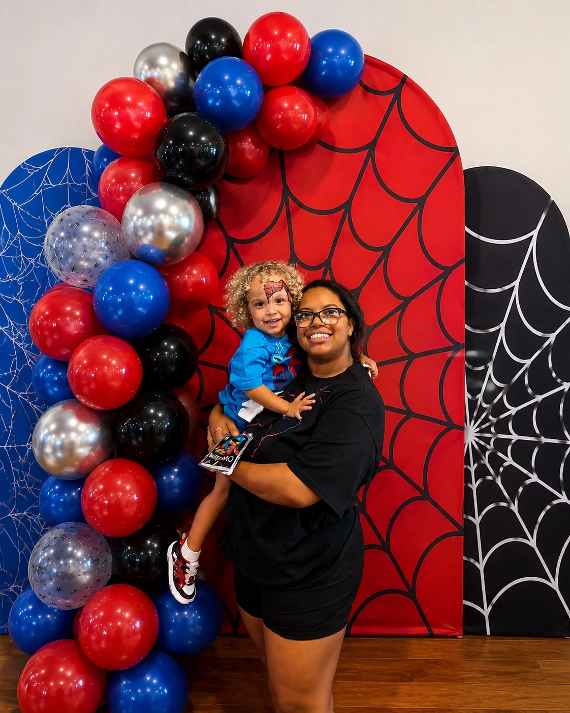 Spider-Man themed balloon garland and arched backdrop setup in Clermont Florida
